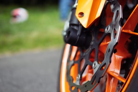 motorcycle front wheel close-up,isolated motorcycle wheel on the street at the exhibition. High quality photo