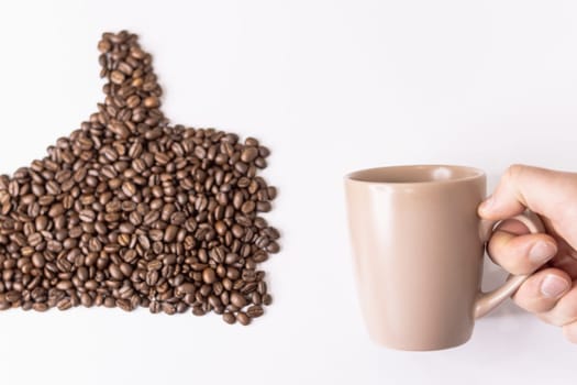 On a white background, a hand drawn coffee beans from the left, on the right side, a male hand holds a light cup. High quality photo