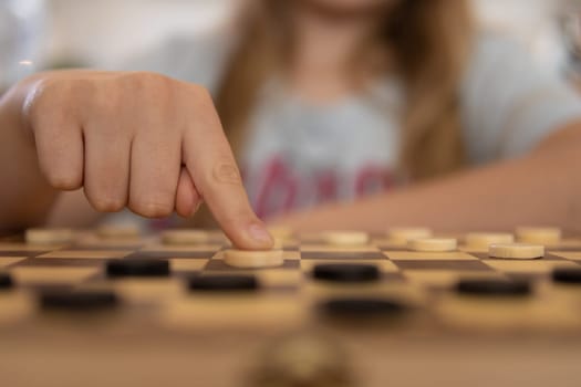 close-up view of a hand of elderly woman playing chess. High quality photo