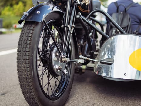 motorcycle front wheel close-up,isolated motorcycle wheel on the street at the exhibition. High quality photo