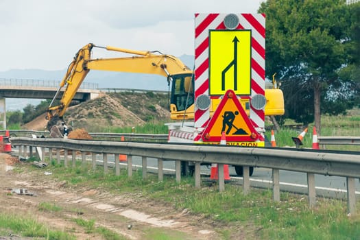 construction of a road and communications for construction. The bulldozer prepares the ground for the construction of the road. High quality photo