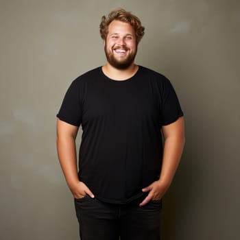 Fat pudge obese chubby overweight man in black t-shirt posing with open smile on grey studio background, plus size male model on basic clothes. AI