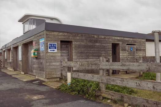 public toilet on the beach, wooden brown. High quality photo