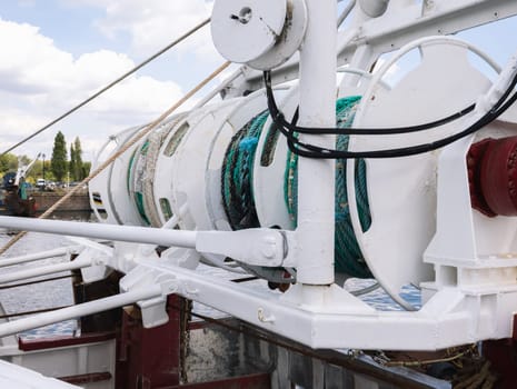 close-up of white spools for cables on a yacht. High quality photo