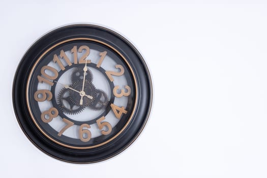 clock on the wall on a white background with space to the right for an inscription. High quality photo