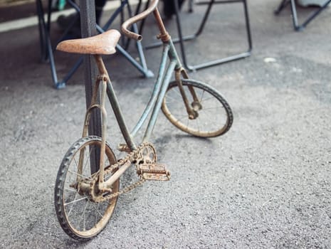 rare bicycle small, covered in rust old close-up on a children's bicycle. High quality photo