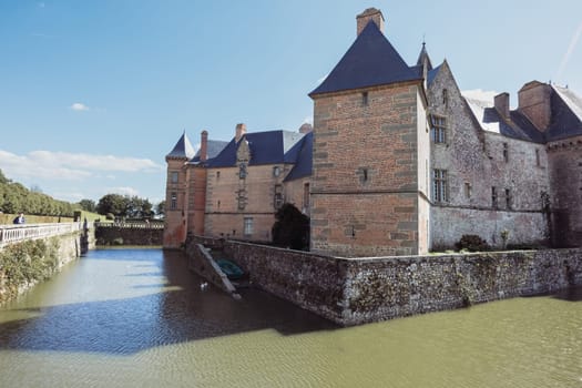 The ancient building of the chateau in France around the lake building, the building close-up has a place for the inscription. High quality photo