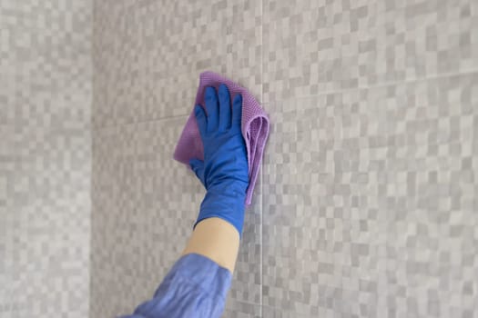 cleaning and washing the bathroom close-up of a girl's hand. High quality photo