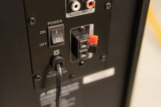 Close-up of the speaker connectors on the back of the AV receiver. High quality photo
