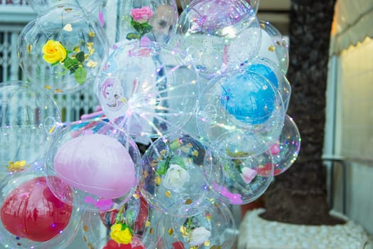 balloons close-up on the street on the ribbon a lot of multi-colored balloons, there is a place for an inscription. High quality photo