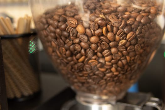 coffee grinder with coffee beans in a coffee shop. High quality photo