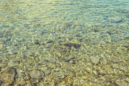 close-up sea with a rocky sunset, there is a place for an inscription, a beautiful seascape. High quality photo