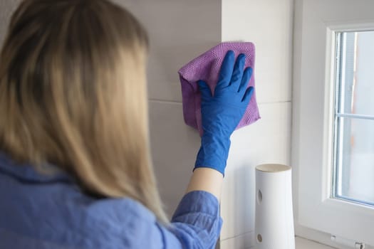 cleaning and washing the bathroom close-up of a girl's hand. High quality photo