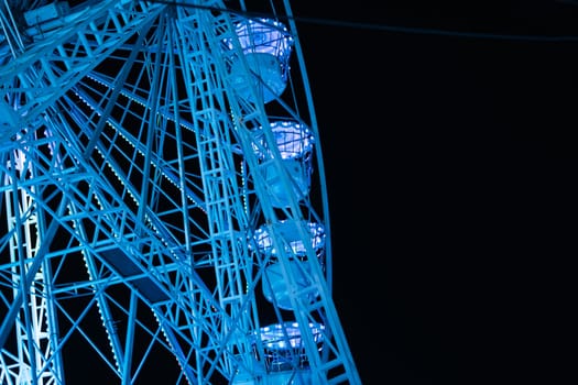 ferris wheel in the lunopark in the evening, close-up there is a place for an inscription. High quality photo