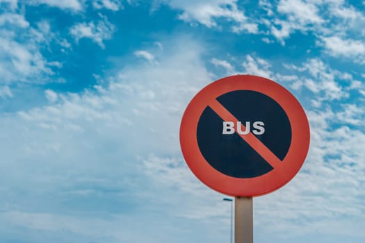 traffic sign for buses no stopping isolated on blue sky background. High quality photo