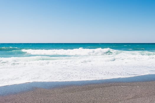 beautiful beach with sand, turquoise sea with waves. High quality photo