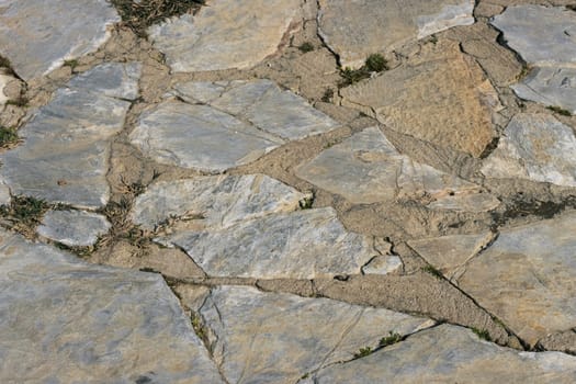 path in the yard made by hand from stones of various shapes. High quality photo