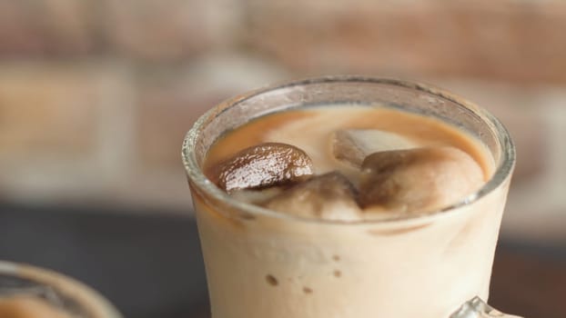 Iced coffee in glass jars on the table.