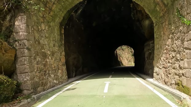 Point of view shot of riding a bicycle in Vouzela, Portugal. Features a wide view of the bike track and the natural scenery.