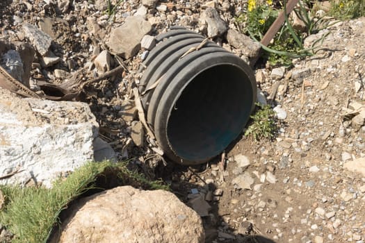 a pipe from which sewerage with waste flows, environmental pollution. High quality photo