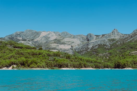 Mountain landscape, picturesque mountain lake on a summer morning, large panorama, Spain, Guadalest. High quality photo