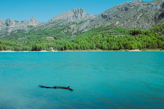 A beautiful mountain landscape, a view of the mountains and a lake with turquoise water, there is a place for an inscription. High quality photo