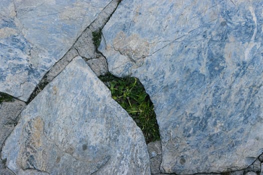 path in the yard made by hand from stones of various shapes. High quality photo