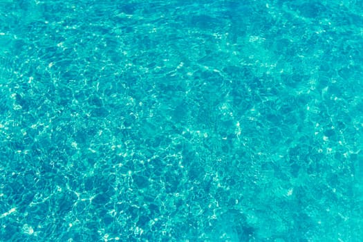 texture of blue water in the pool close-up, there is a place for an inscription. High quality photo