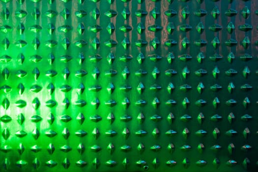 Abstract metal texture with green color closeup, there is a place for an inscription. High quality photo