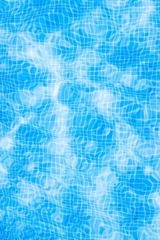 texture of blue tiles and water in the pool close-up, there is a place for an inscription. High quality photo