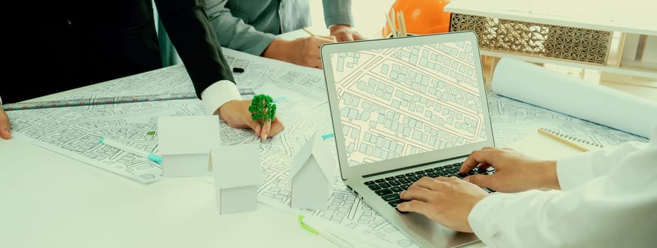 Worker, architect and engineer work on real estate construction project oratory planning with cartography and cadastral map of urban town area to guide to construction developer business plan of city