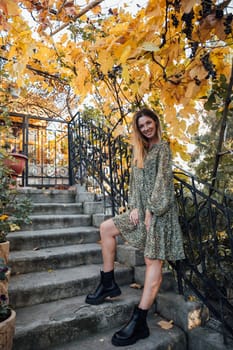 woman on steps in a park on the street walk