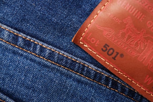 Close up of the details of new LEVI'S 501 Jeans. Seams and denim texture close-up. Classic jeans model. LEVI'S is a brand name of Levi Strauss and Co, founded in 1853. 31.12.2021, Rostov, Russia.