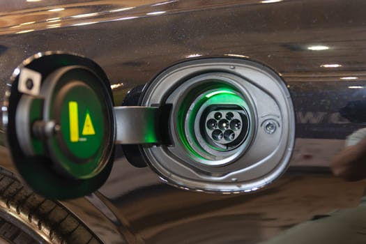 A close up of a metal object with a green light