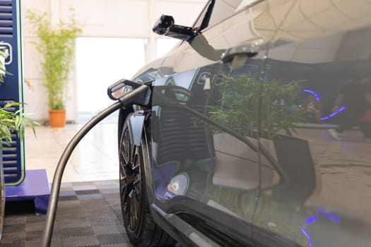 An electric car being charged at a charging station