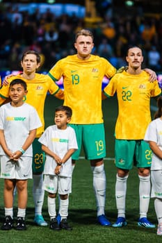 MELBOURNE, AUSTRALIA - NOVEMBER 16: National anthem atmosphere before the 2026 FIFA World Cup Qualifier match between Australia Socceroos and Bangladesh at AAMI Park on November 16, 2023 in Melbourne, Australia