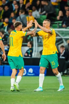 MELBOURNE, AUSTRALIA - NOVEMBER 16: Mitchell Duke of Australia celebrates scoring with teammates during the 2026 FIFA World Cup Qualifier match between Australia Socceroos and Bangladesh at AAMI Park on November 16, 2023 in Melbourne, Australia