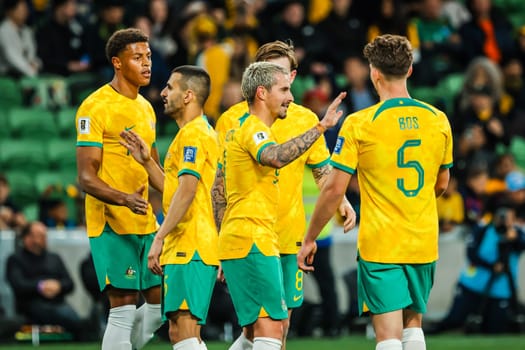 MELBOURNE, AUSTRALIA - NOVEMBER 16: Jamie Mclaren of Australia celebrates scoring with teammates during the 2026 FIFA World Cup Qualifier match between Australia Socceroos and Bangladesh at AAMI Park on November 16, 2023 in Melbourne, Australia