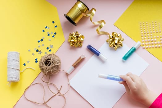 Winter holidays background. Gift wrapping and decorating christmas present, boxes in craft paper with satin silver ribbon.