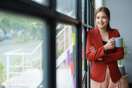 Businesswoman enjoys relaxing with a cup of coffee after a long day