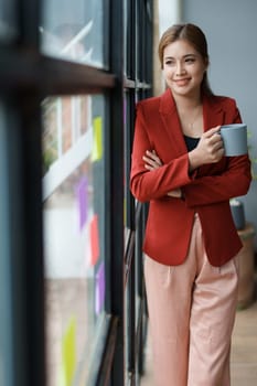 Businesswoman enjoys relaxing with a cup of coffee after a long day