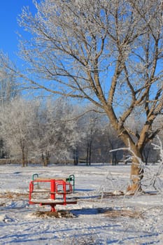 Children`s playground in winter without children