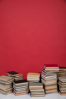 an education science learning library stack of books on a red background