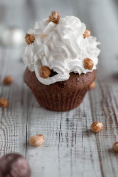 Delicious chocolate brownie muffins with nuts and whipped cream