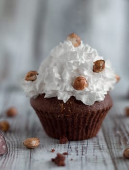 Delicious chocolate brownie muffins with nuts and whipped cream