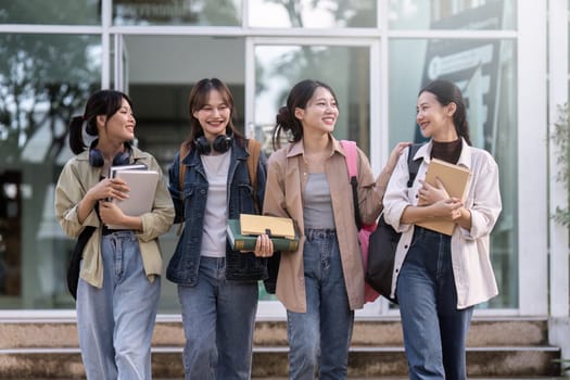 Group of Young Asian student walking and talking at university before class room. education, back to school concept.