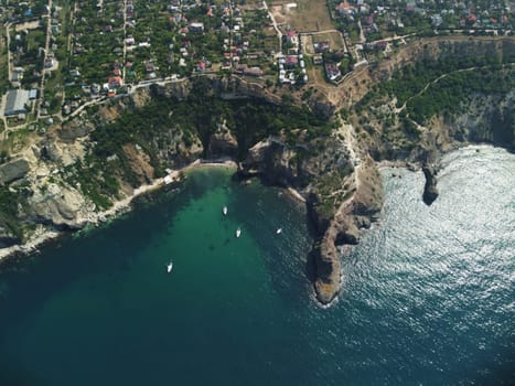 Aerial panoramic view of beautiful sunset above sea. Beautiful seascape. Sun glare, small waves on the water surface. Evening. Horizon. Nobody. No people. Copy space. Never-ending beauty of nature