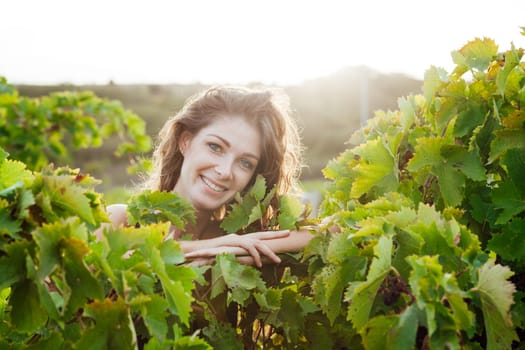 portrait of woman in grape leaves walk