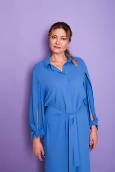 woman in blue clothes on a purple background