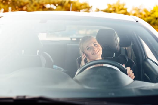 a woman driving talking on phone driver journey